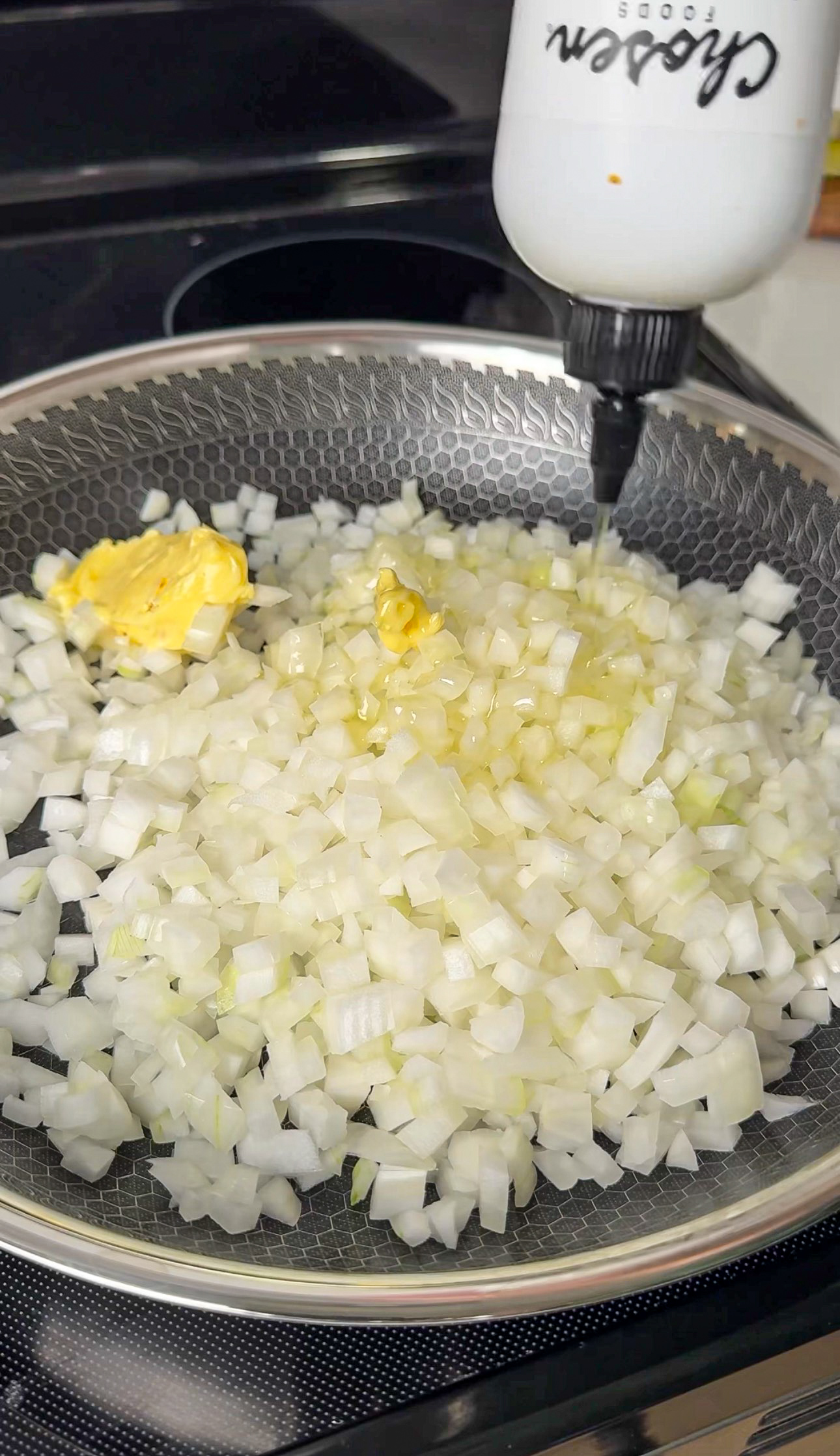 Adding butter and oil to the onions